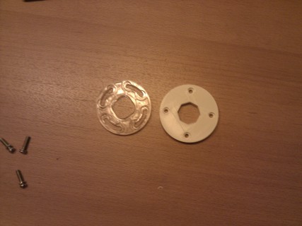 Restrictor plates. Original on the left. Custom printed one on the right.