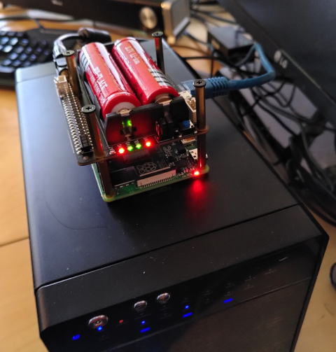 Raspberry Pi with X725 board on top of RAID enclosure